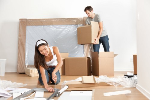 Removal team preparing boxes for a North London move
