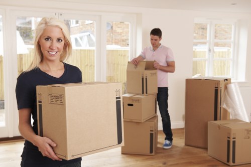 Professional removals team handling furniture with care