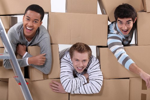 Removal team preparing boxes and furniture for a North London move