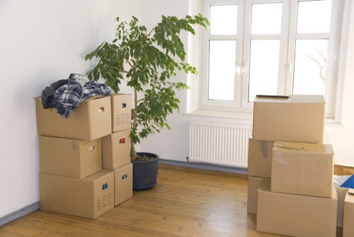 Office relocation equipment and labeled boxes ready to move