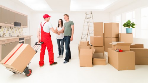Professional movers loading furniture for a move in North London