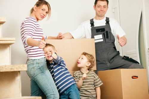 Careful packing of fragile household items for relocation